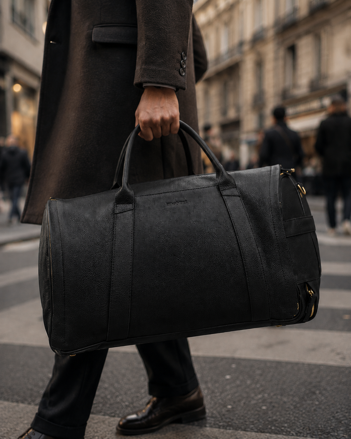 Classic Black NOVA duffle carried on a city street
