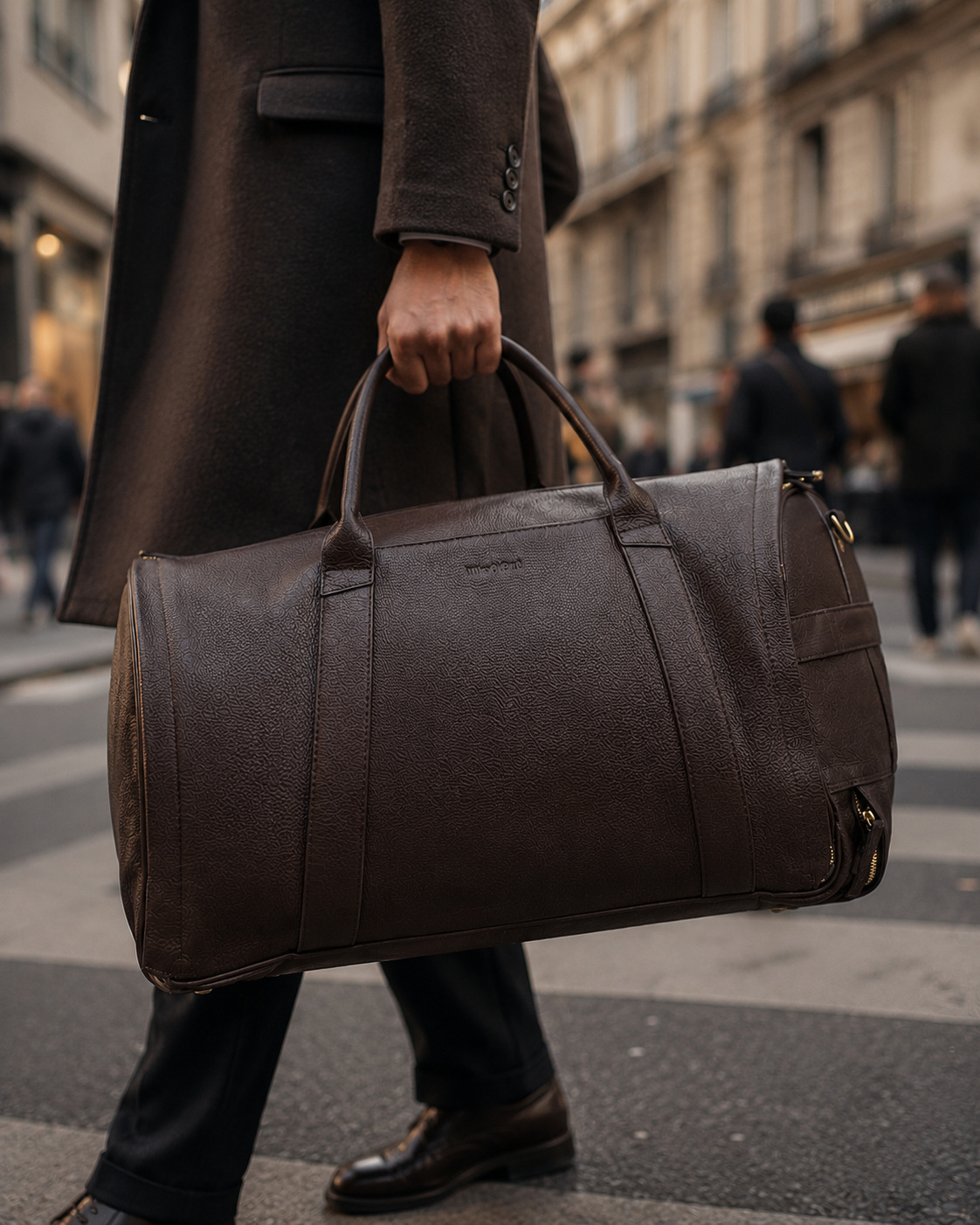 Chocolate Brown NOVA duffle carried on a city street