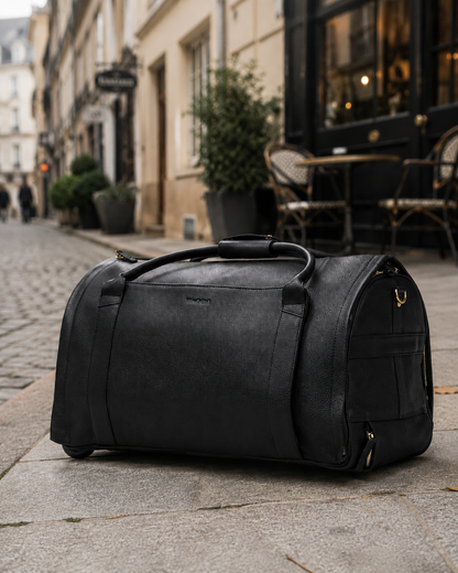 Classic Black NOVA duffle on a city street